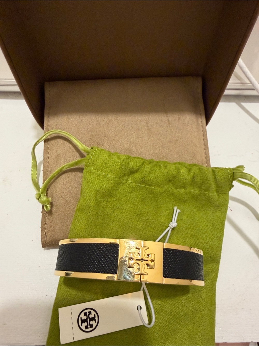 Tory Burch Gold Tone Hinged Bangle Bracelet